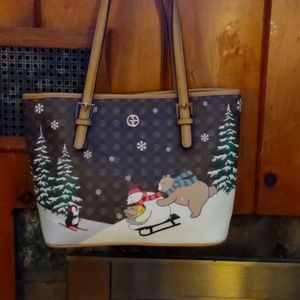What i am selling is a nice never used bag limited addition. Winter theme.